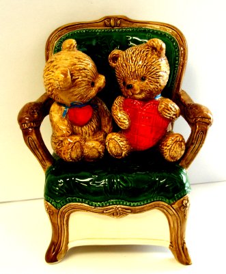 Two Teddy Bears on Green Chair