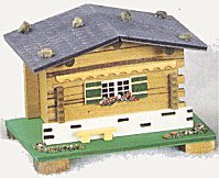 Swiss Chalet  Music Box with bench & logs