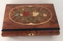 two flowers leaves and buds framed in birch on Rosewood Musical Box 